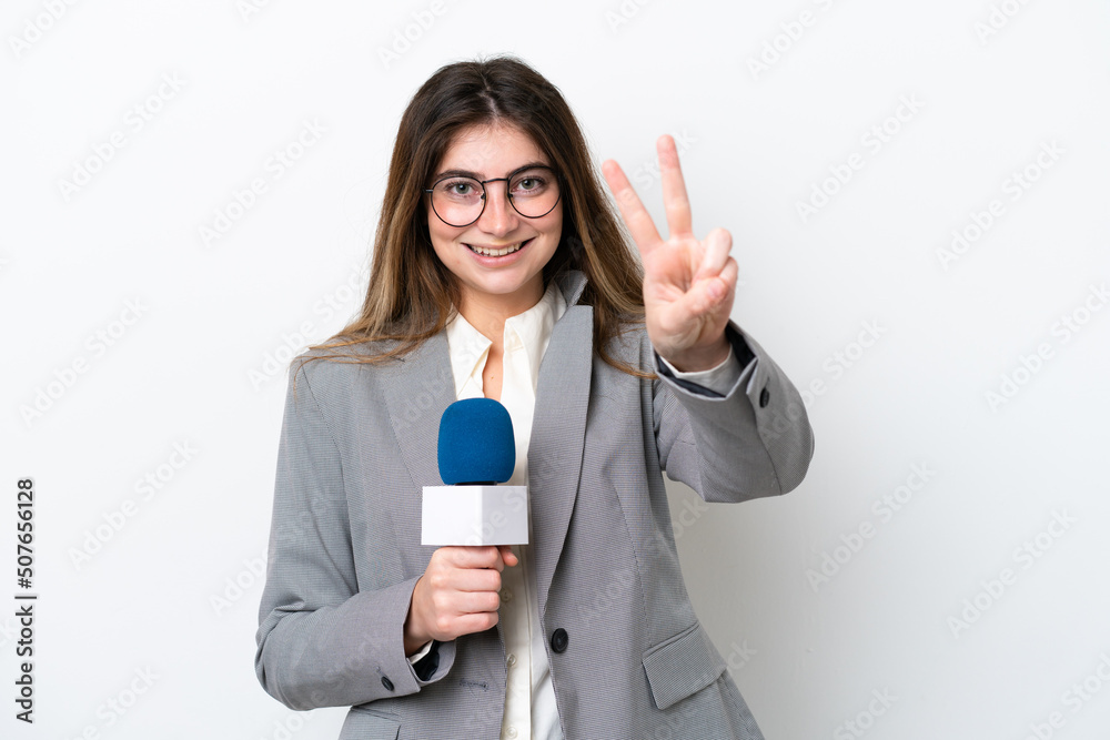 Young caucasian TV presenter woman isolated on white background smiling and showing victory sign Young caucasian TV presenter woman isolated on white background smiling and showing victory sign