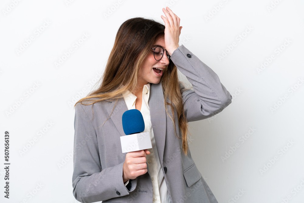 Young caucasian TV presenter woman isolated on white background has realized something and intending the solution Young caucasian TV presenter woman isolated on white background has realized something and intending the solution