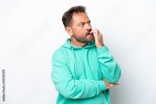 Middle age caucasian man isolated on white background is a little bit nervous