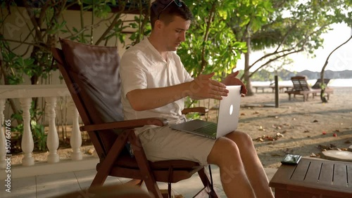 Wallpaper Mural Man happy of workday ending on vacation at tropical island. Caucasian man closes laptop puts on sunglasses and start to rest and relax. Torontodigital.ca