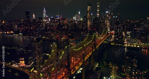 Wallpaper Mural Ed Koch Queensboro Bridge with splendid backlight at night. Stunning panorama of New York City skyscrapers shining bright. Torontodigital.ca