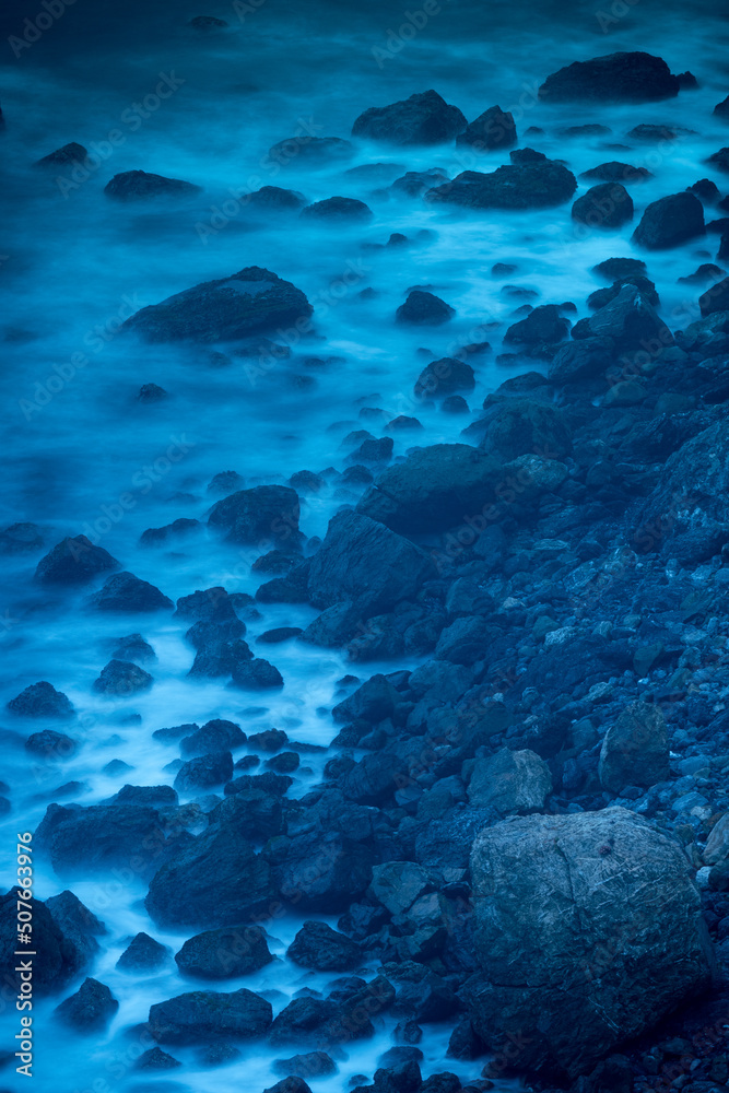 Fototapeta premium moody rocks on shore