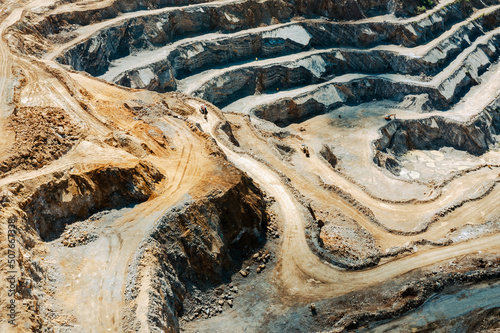 Foto Industrial terraces in a mining quarry