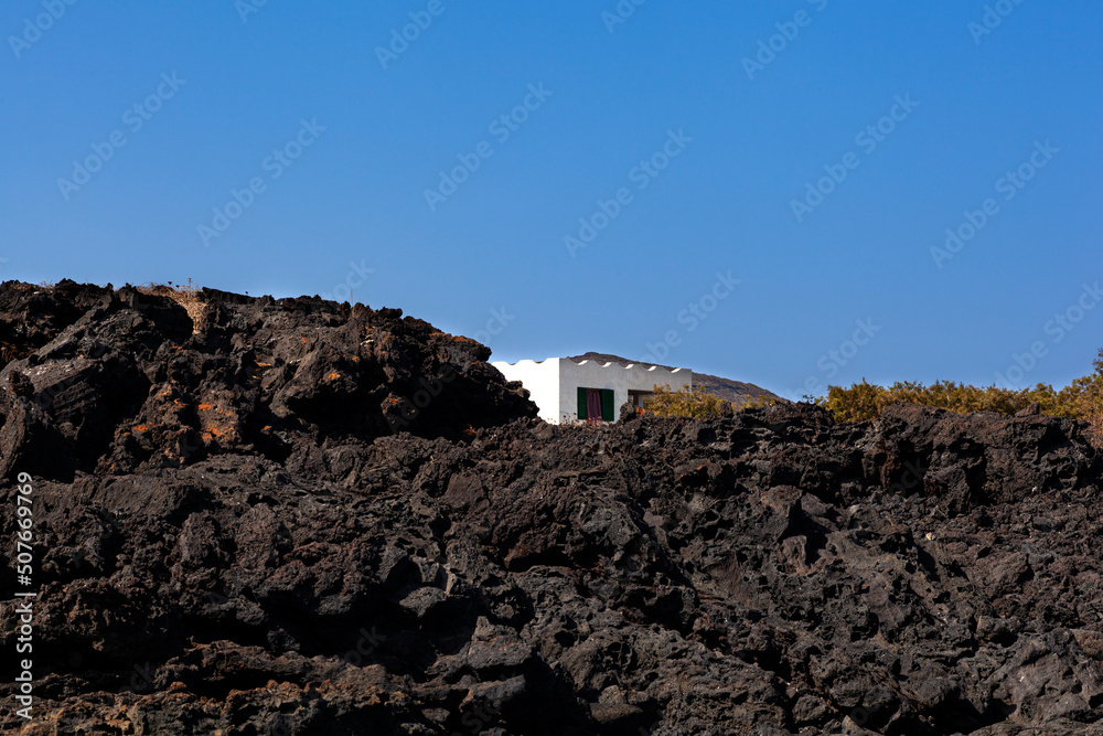 View of white house in the lava hill, Sicily