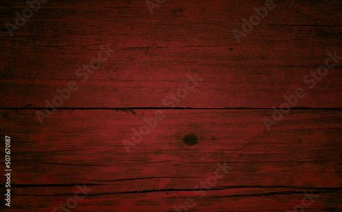 old red wood texture background. close up red wooden table showing rough wood grain and wood pith. old plank lumber wood. colorful wooden background grunge.