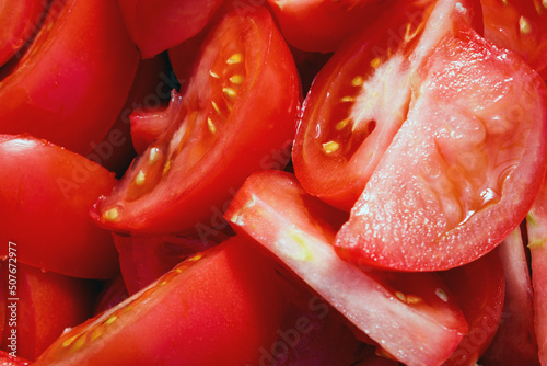Red tomato background. Sliced tomatoes in close - up photos © Armands photography