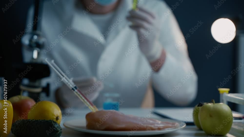 Scientists are testing genetically modified fruits, vegetables, meat for quality, presence of toxins, antibiotics and GMOs in the laboratory. DNA engineering industry. Bio engineering concept. Scientists are testing genetically modified fruits, vegetables, meat for quality, presence of toxins, antibiotics and GMOs in the laboratory. DNA engineering industry. Bio engineering concept.