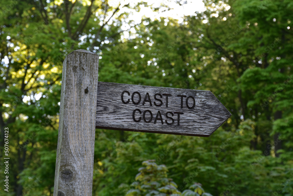 Wood Coast to Coast Sign Post Directing Walkers
