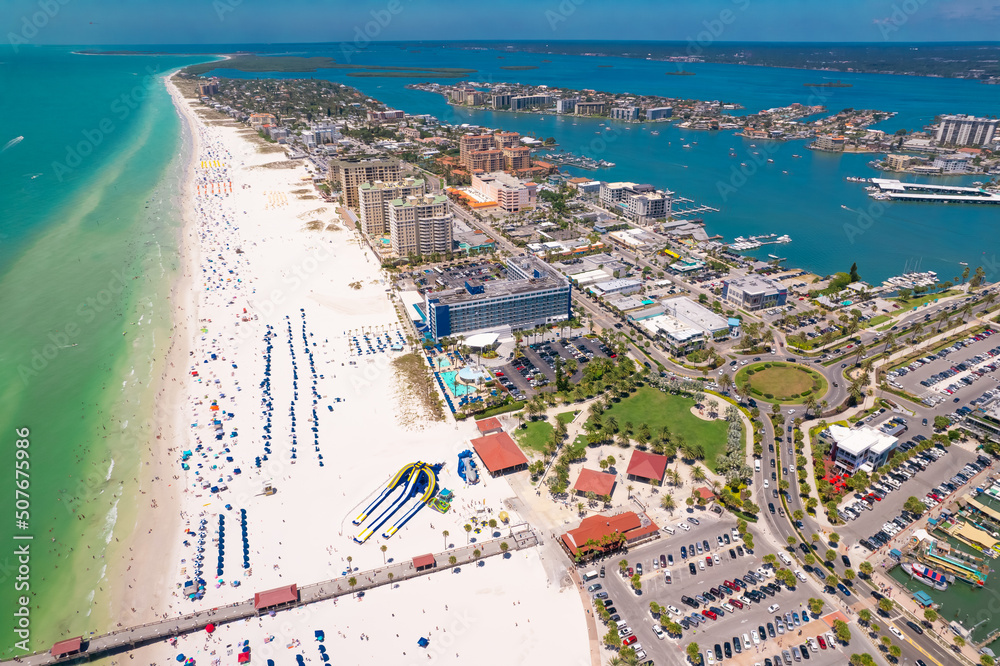 Florida Beaches. Panorama of Clearwater Beach FL. Summer vacations. Beautiful View on Hotels and Resorts on Island. Turquoise color of Ocean water. American Coast or shore Gulf of Mexico. Sunny Day.