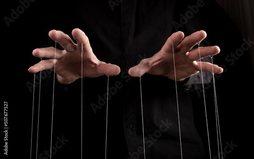 Fototapeta Man hands with strings on fingers