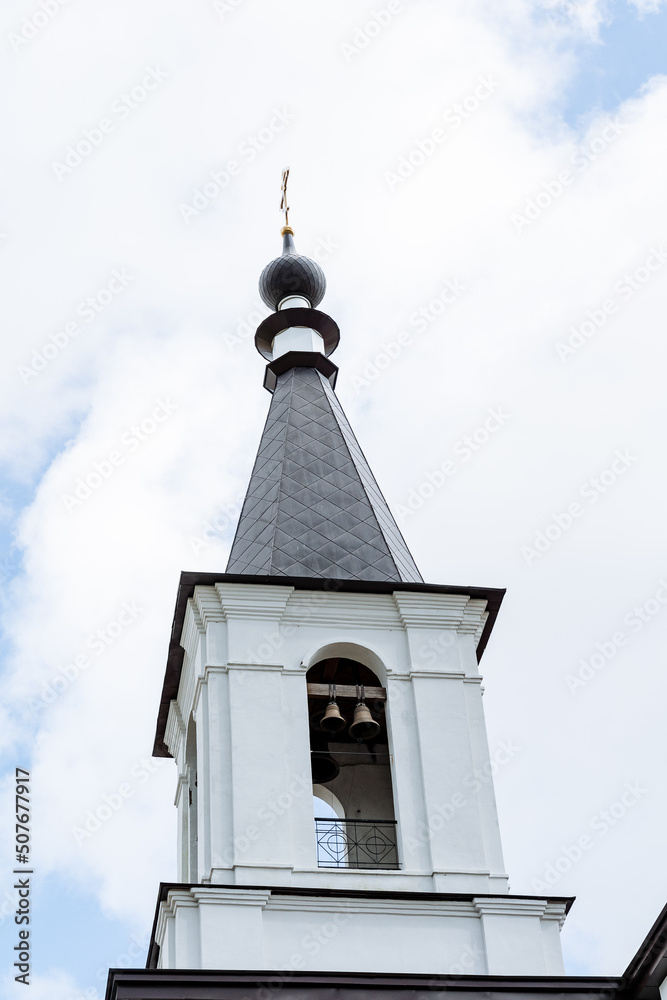 The bell tower, the white tower of the church church with bells, the bronze bell, the bell ringer, to distribute the sound to the whole district. The bell tower, the white tower of the church church with bells, the bronze bell, the bell ringer, to distribute the sound to the whole district.