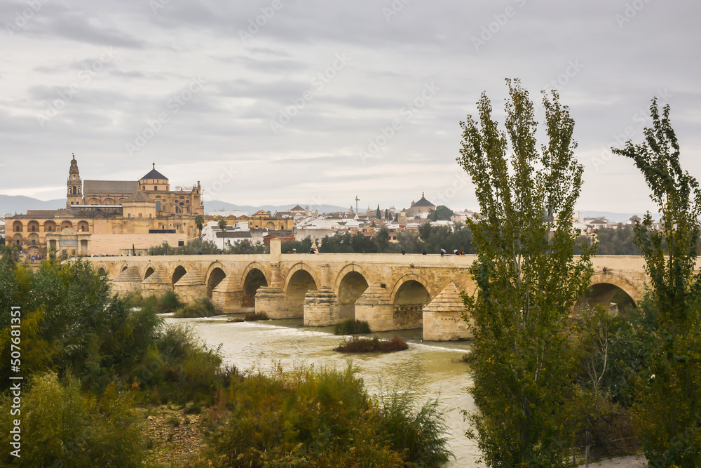 The Roman bridge in Cordoba over the Guadalquivir river. The Roman bridge in Cordoba over the Guadalquivir river.