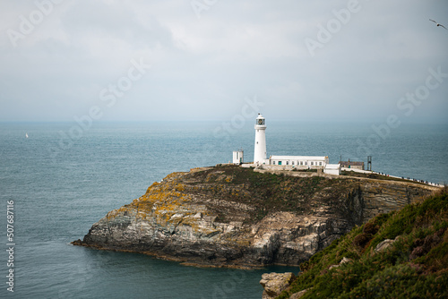 South Stack Lighthouse, Wales, Anglesey, UK. It is built on the summit of a small island off the north-west coast of Holy Island. It was built in 1809 to warn ships of the dangerous rocks below.