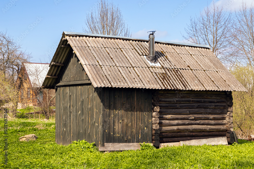 Small Russian sauna building exterior on a daytime
