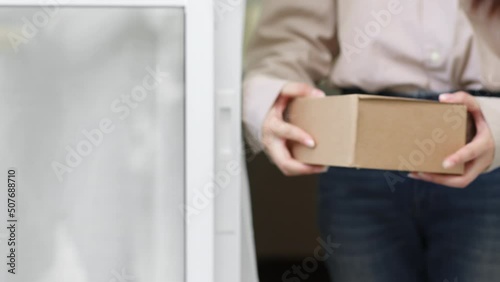 Wallpaper Mural Closeup hands courier delivery man sending box parcel to customer, delivery concept Torontodigital.ca