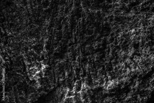 Grunge Rough structure. Black texture. Stone background. Dark marble. Rock texture. Rock surface with cracks. Rock pile. Paint spots wall. Abstract texture.