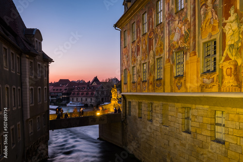 Bamberg. Germany. An artificial island across the river Regnitz. City Hall Bamberg at night. Both bridges connect it to both banks.