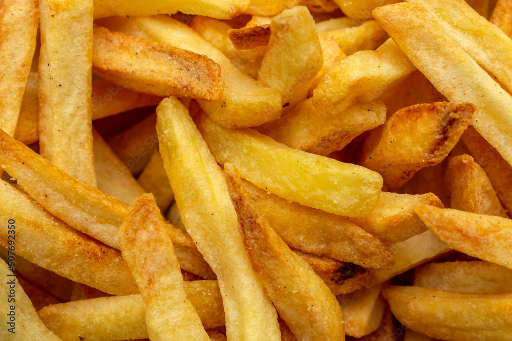 Closeup em uma porção de batatas fritas prontas para o consumo. Closeup em uma porção de batatas fritas prontas para o consumo.
