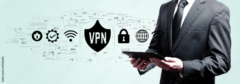 Obraz premium VPN concept with businessman holding a tablet computer