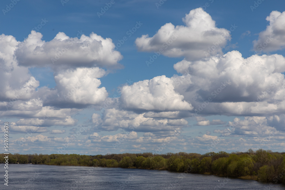 Landscape with river flooding, forest in spring.