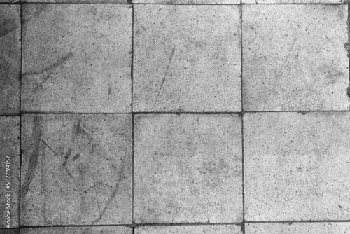 Tile texture. Black and white floor tiles texture. Small gray squares. Abstract image in gray color.