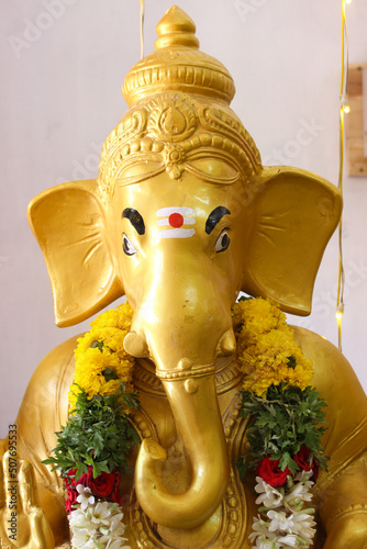 Close up of golden Ganapati Vinayaga statue
