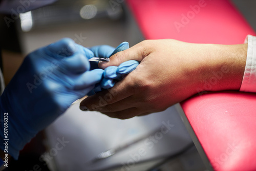 manicurist makes a manicure. The process of creating a quality manicure. Personal care. Beauty industry 