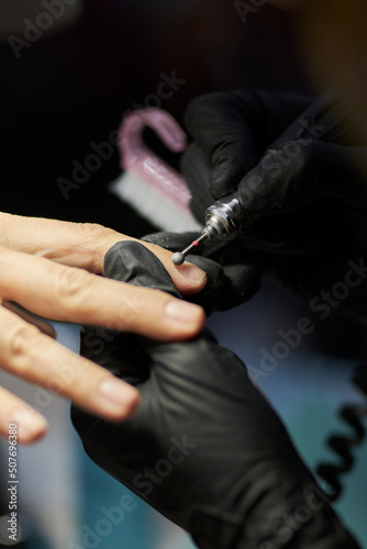 manicurist makes a manicure. The process of creating a quality manicure. Personal care. Beauty industry 