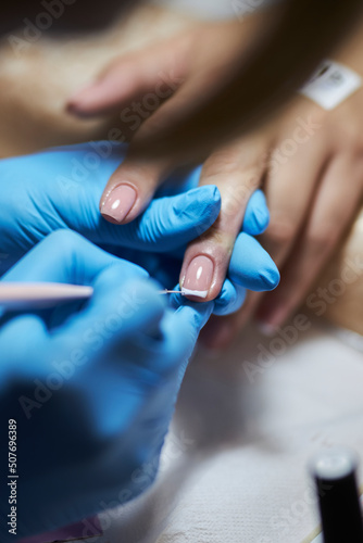 manicurist makes a manicure. The process of creating a quality manicure. Personal care. Beauty industry 