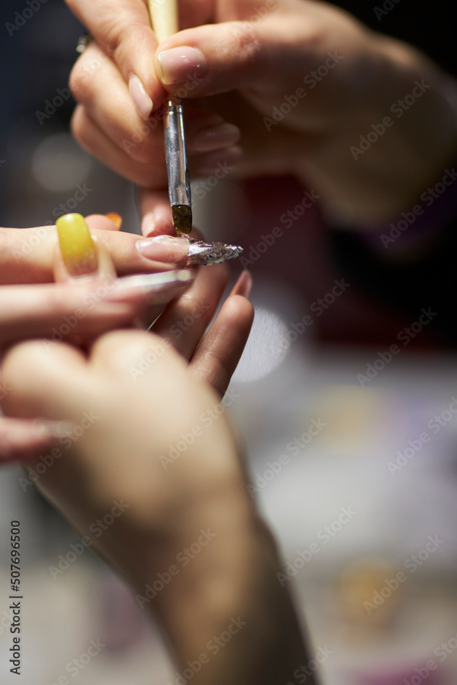 manicurist makes a manicure. The process of creating a quality manicure. Personal care. Beauty industry 