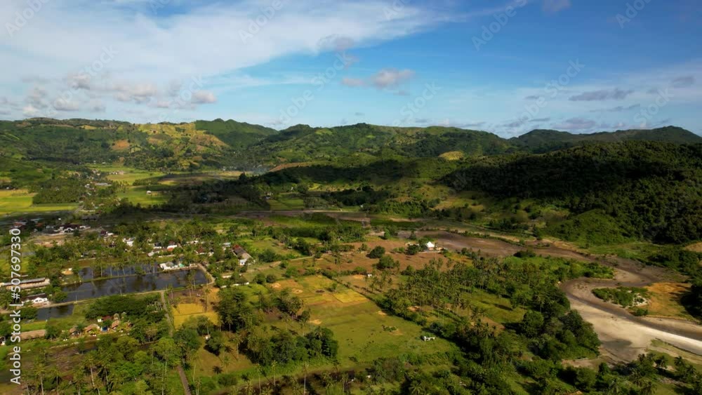 Aerial view of Selong Belanak, Tropical island with sandy beach and turquoise ocean with waves. Lombok. Indonesia Aerial view of Selong Belanak, Tropical island with sandy beach and turquoise ocean with waves. Lombok. Indonesia