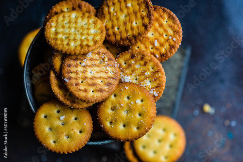 Overhead view of Salted cracker cookies in a metal bucket on a table