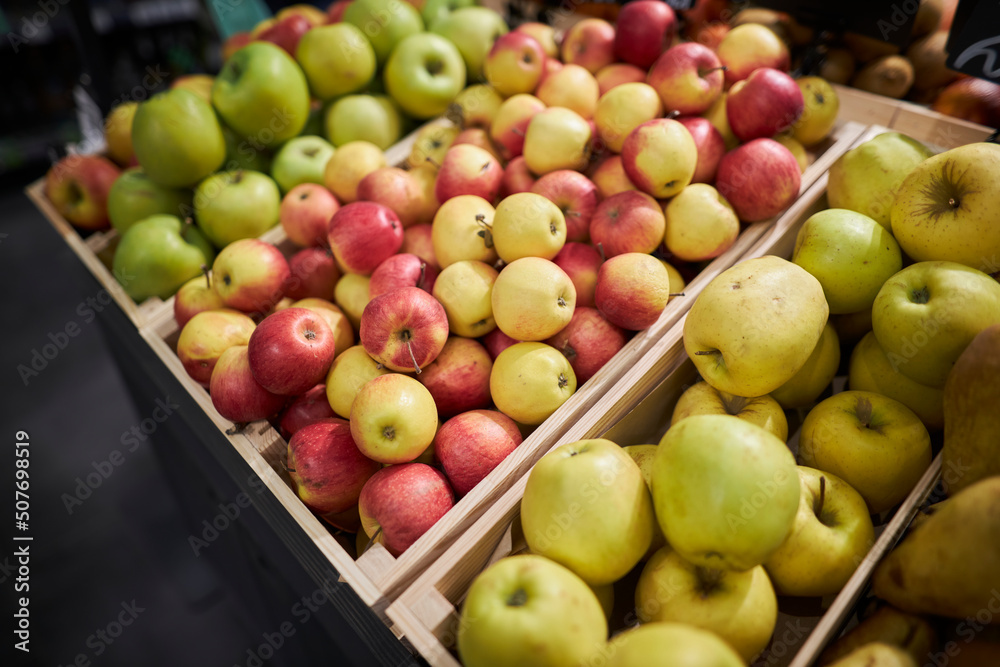Fruit stand in the supermarket. apples on the counter 