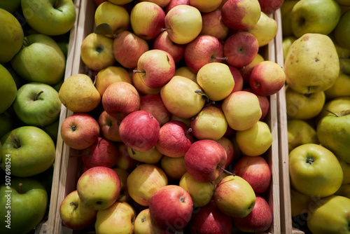Fényképezés Fruit stand in the supermarket. apples on the counter