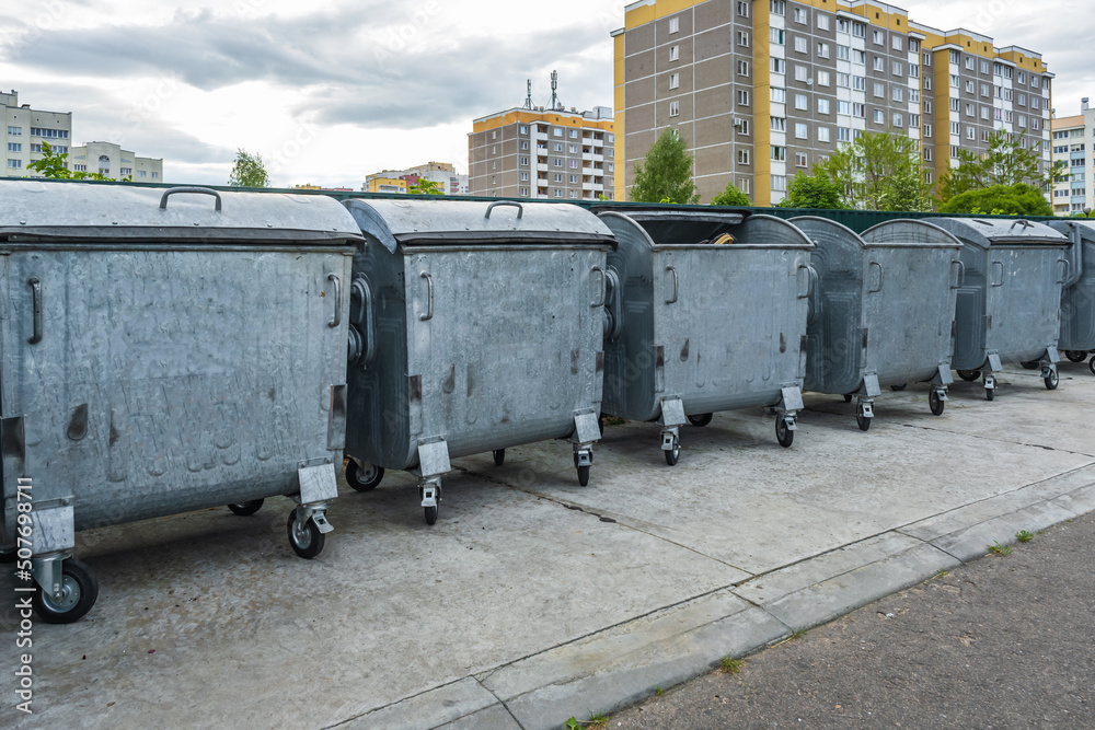 metal trash cans for separate waste collection in a densely populated area of the city metal trash cans for separate waste collection in a densely populated area of the city