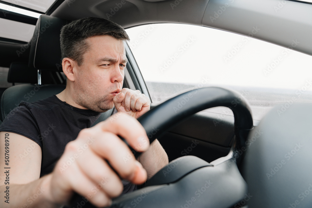 a sleepy and yawning man drives a car on the highway a sleepy and yawning man drives a car on the highway