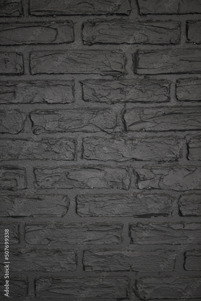 Texture of brick decorative wall in dark gray color Texture of brick decorative wall in dark gray color