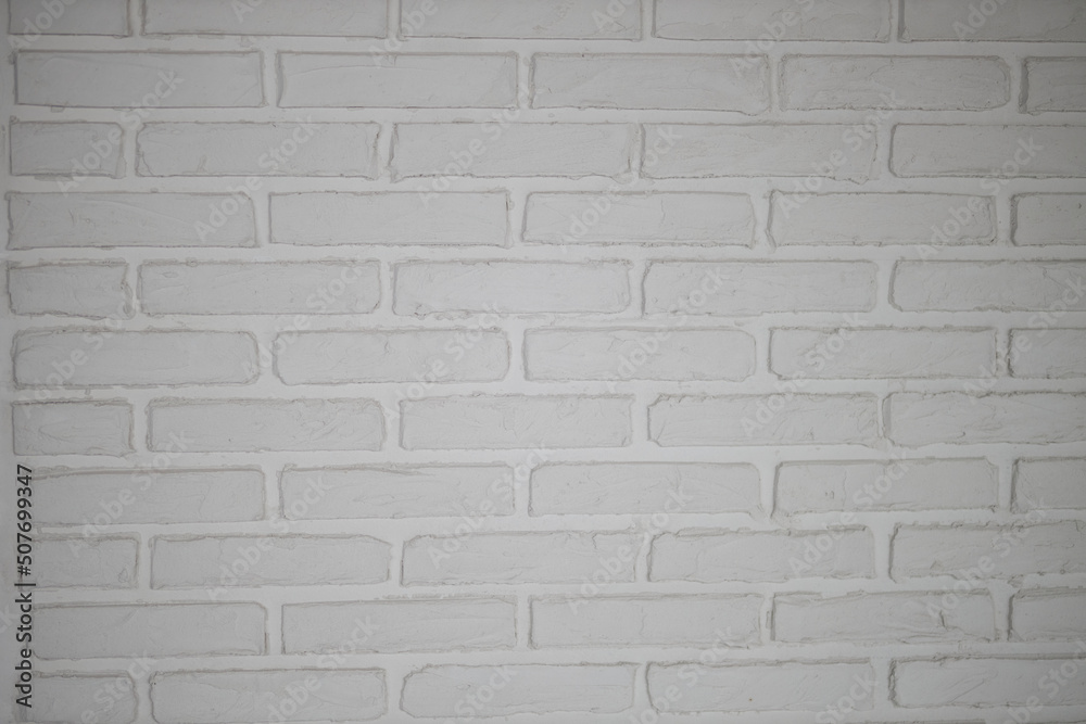 Naklejka premium Texture of brick decorative wall in white color
