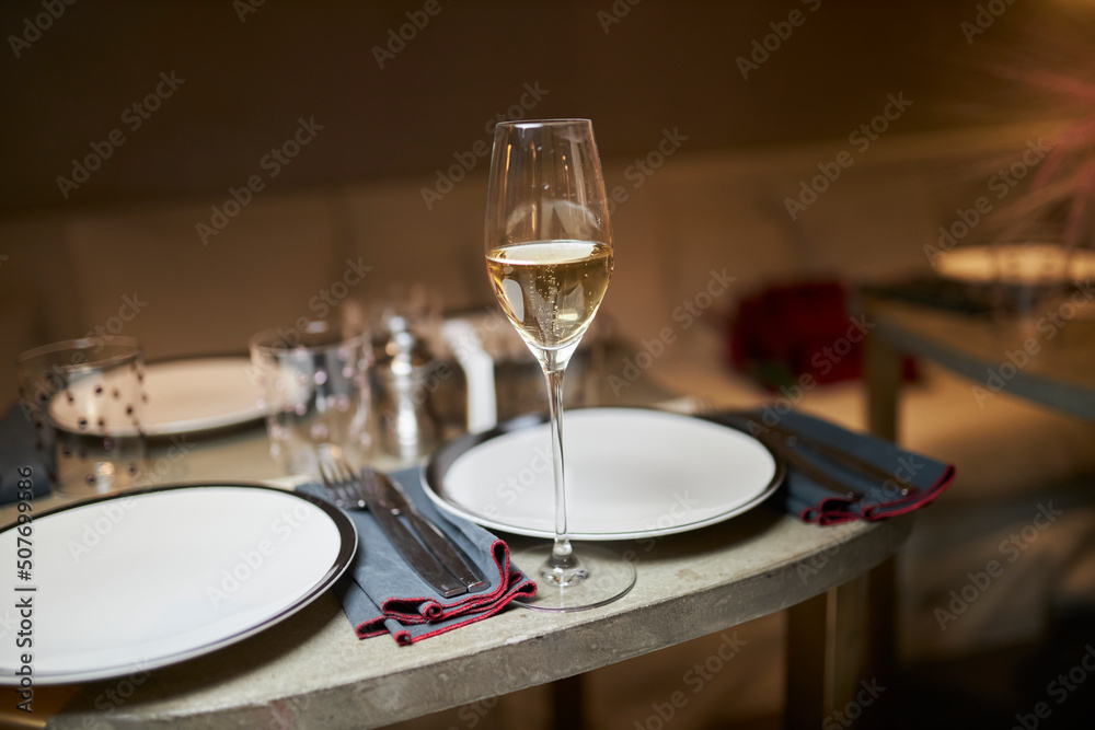 Served table. On the table are plates, dishes and glasses. 