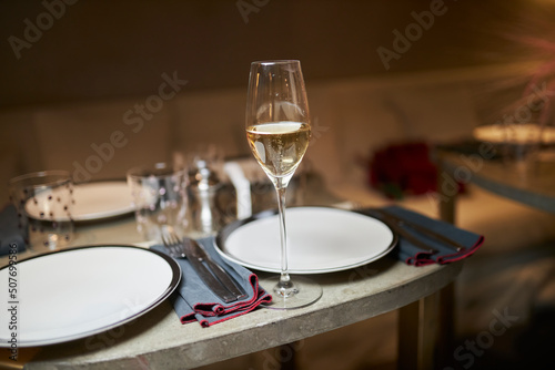 Served table. On the table are plates, dishes and glasses. 