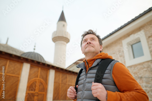 Mature tourist enjoy a stroll through the old town of Trebinje, Bosnia and Herzegovina. photo