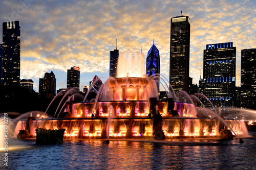 Buckingham Water fountain shot to capture the beautiful sunset and colorful light changes illuminating the Chicago skyline in the background.