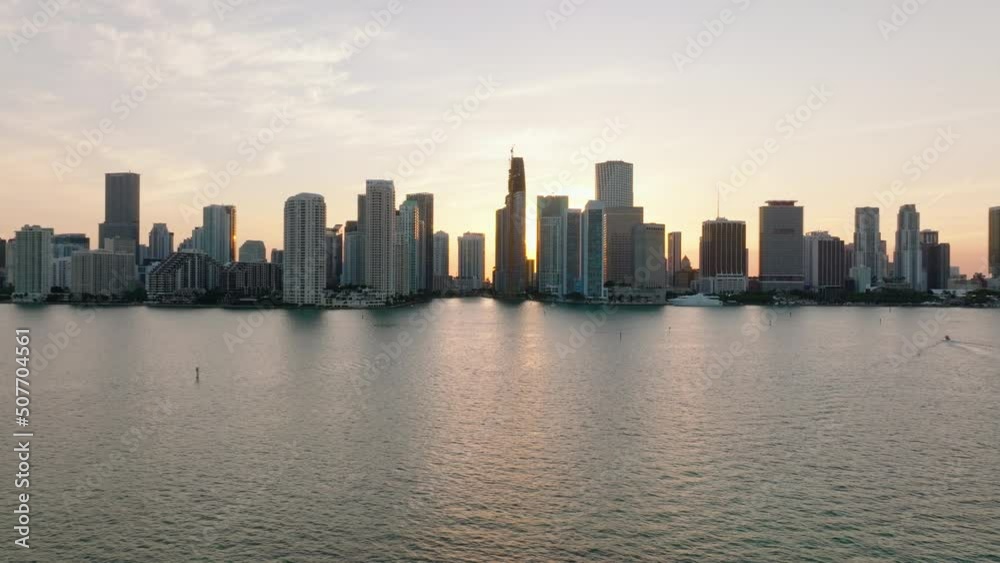 Beautiful view of modern high rise residential buildings on waterfront. Romantic view against setting sun. Miami, USA Beautiful view of modern high rise residential buildings on waterfront. Romantic view against setting sun. Miami, USA