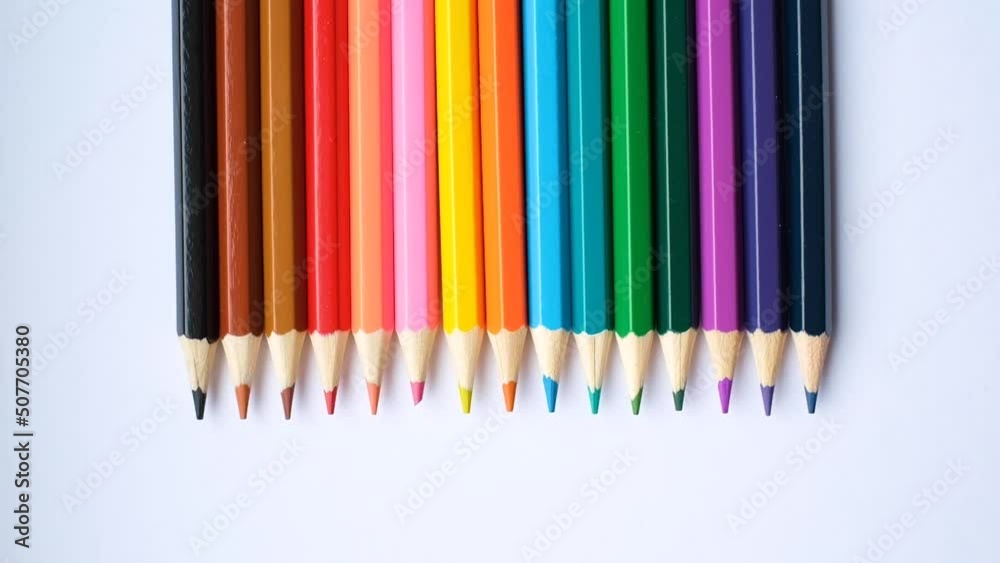 A set of colored pencils isolated on a white background in banner format. Place for text A set of colored pencils isolated on a white background in banner format. Place for text