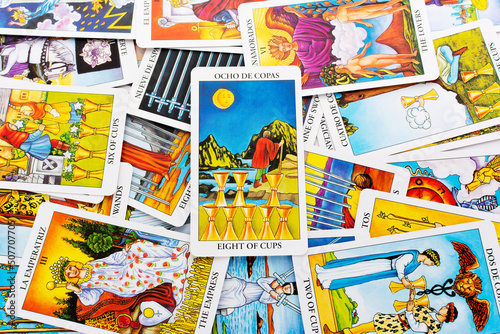 Tarot cards, Rider Waite tarot cards,the eight of cups card in the foreground.