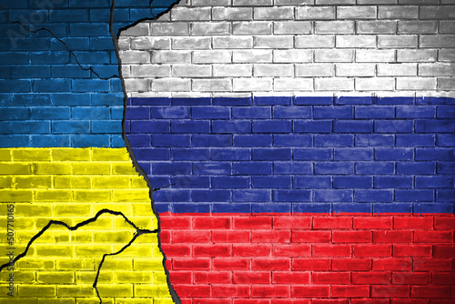 Ukraine and russia Flag on brick wall diplomatic relations between Ukraine and russia. Flag of the two countries concept Ukraine Russia conflict