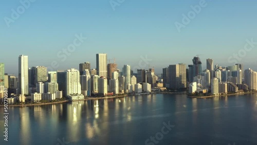 Wallpaper Mural Aerial rising view across vibrant Miami skyscrapers skyline reflecting mirrored in seascape Torontodigital.ca