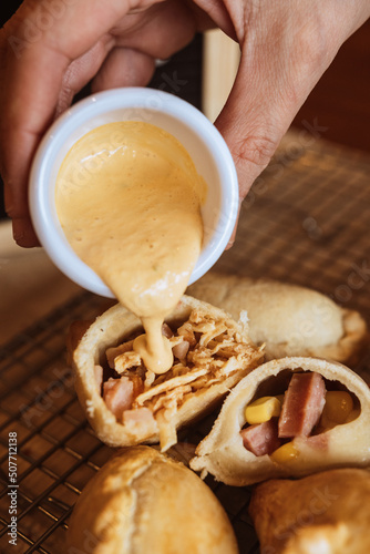 A table with empanadas and sauces