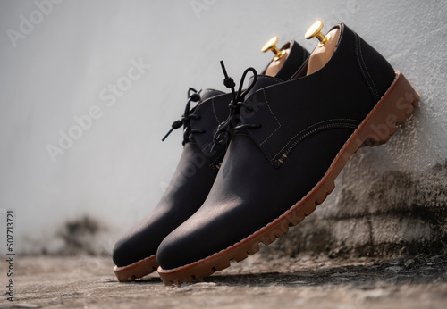 Fotobehang Men fashion black derby shoes leather on the floor.