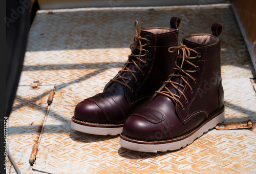 Man fashion brown boot leather on the floor.